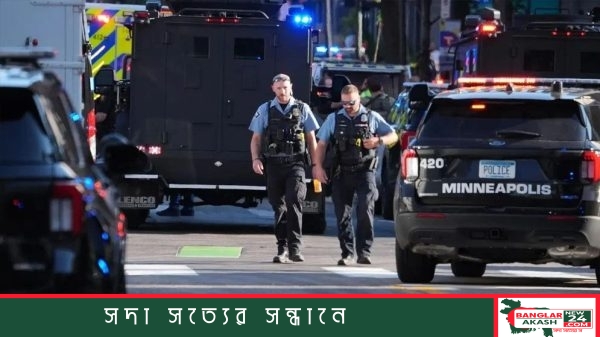 যুক্তরাষ্ট্রের মিনিয়াপোলিসে অ্যাপার্টমেন্ট ভবনে গোলাগুলির পর সতর্ক অবস্থায় পুলিশ ও আইনশৃঙ্খলা বাহিনী